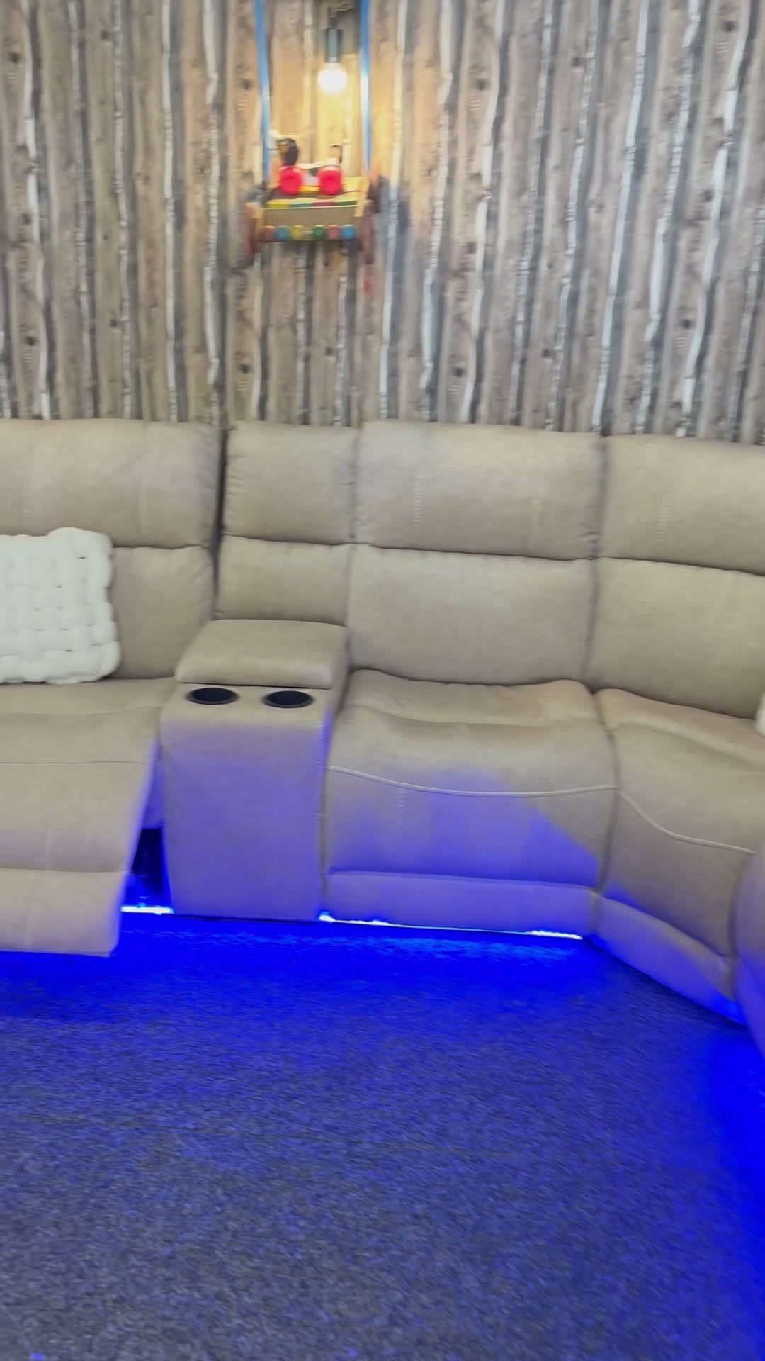 Cream cinema recliner with LED lighting and cup holders