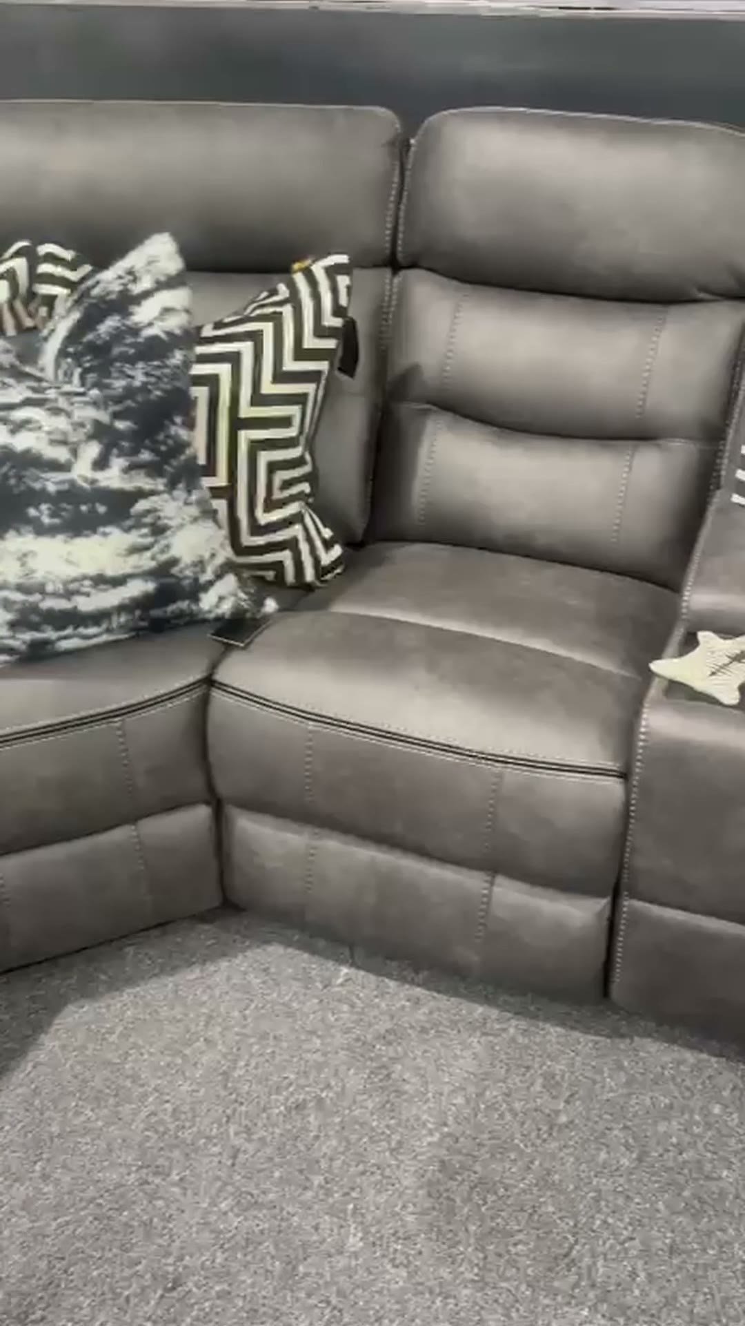 Dark grey electric recliner with console