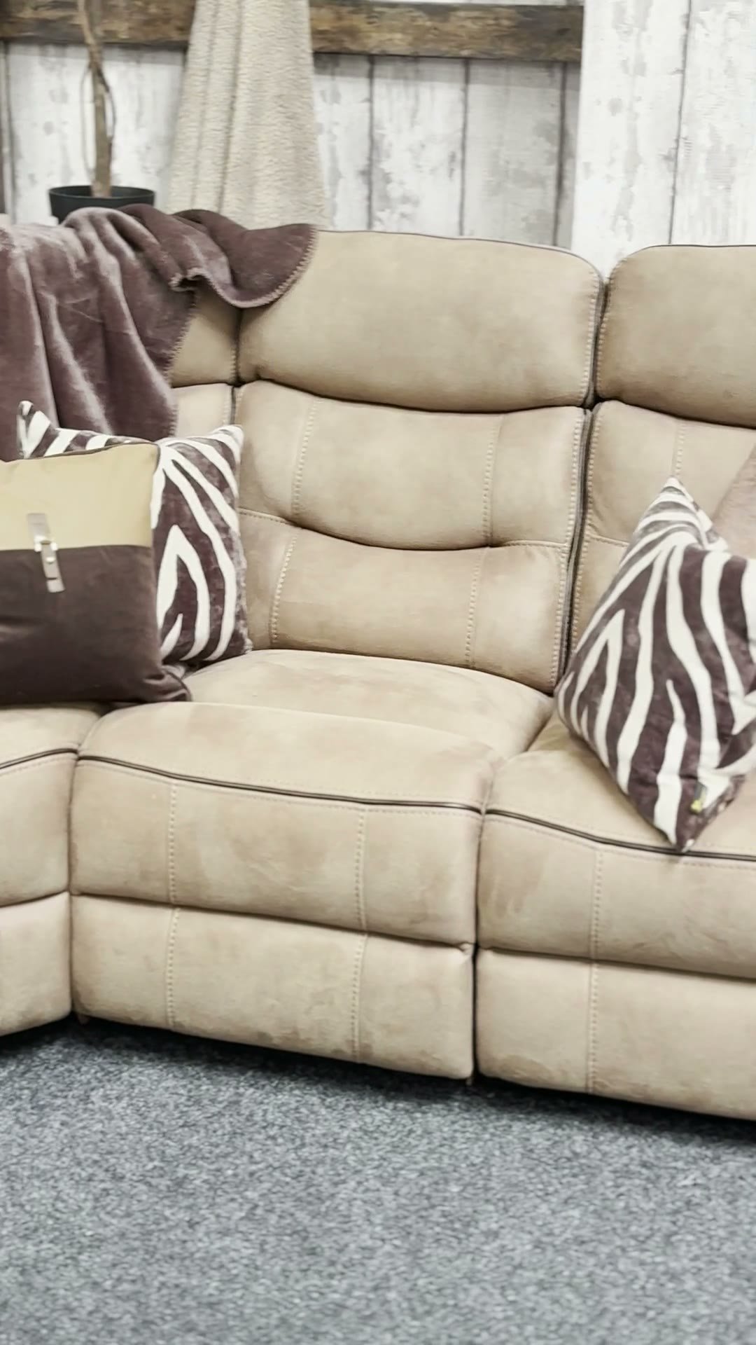 Beige sectional recliner in the showroom