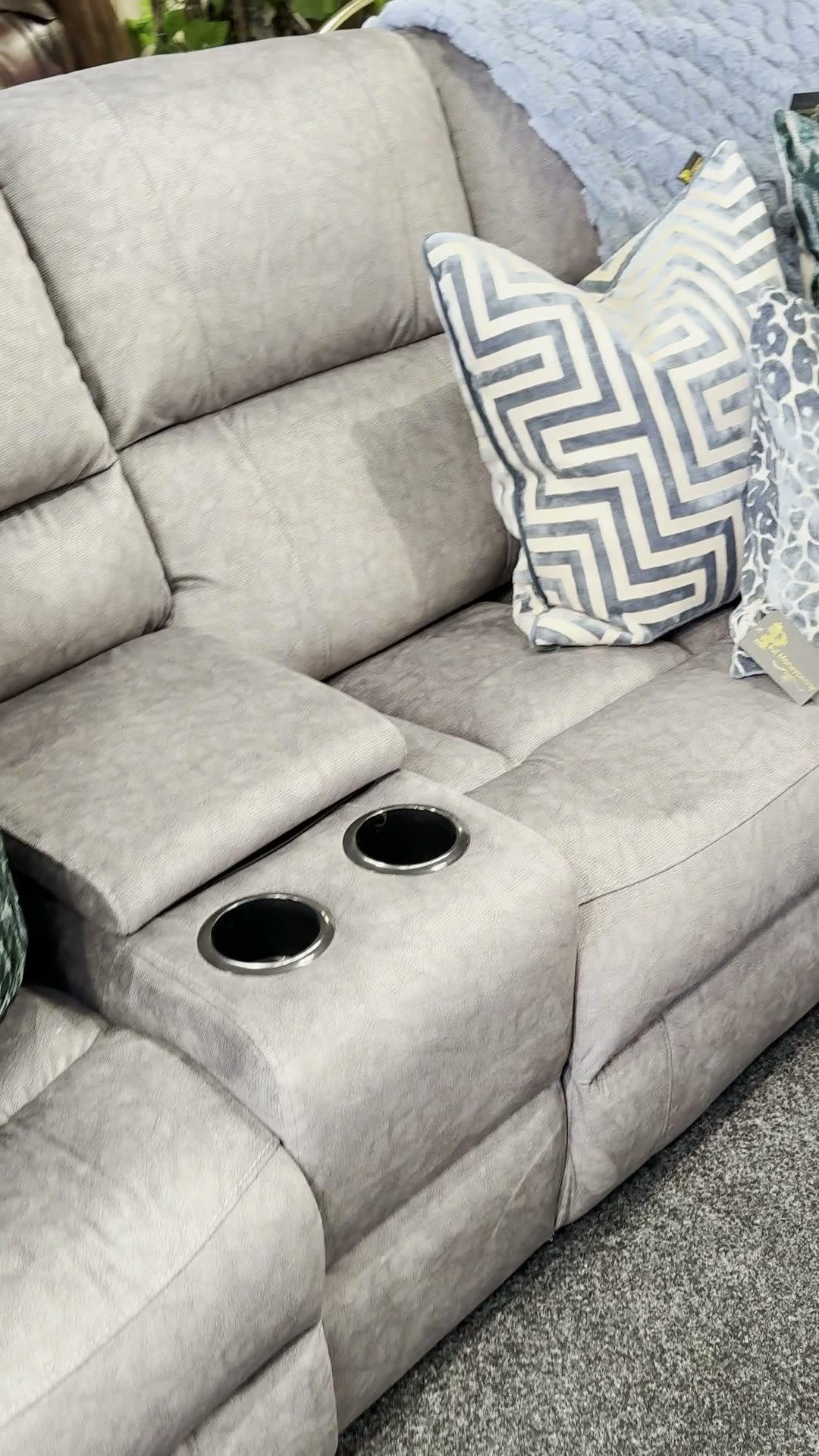 Light grey recliner with cup holders